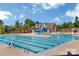 Community pool with a waterslide, lounge chairs, and well-maintained amenities at 9307 Dufaux Dr, Charlotte, NC 28278