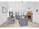 Living room with fireplace and multiple windows at 1011 Emerson Dr, Mooresville, NC 28115