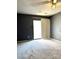 Bedroom with sliding glass doors and ceiling fan at 1017 N Center Nw St, Hickory, NC 28601