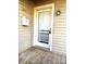 Front entrance with white door and wooden deck at 1017 N Center Nw St, Hickory, NC 28601