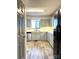 Galley kitchen with light gray cabinets and wood-look floors at 1017 N Center Nw St, Hickory, NC 28601