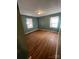 Well-lit bedroom with hardwood floors and neutral-colored walls at 1024 Eaglewood Ave, Charlotte, NC 28212