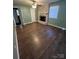 Spacious bedroom with hardwood floors and a brick fireplace at 1024 Eaglewood Ave, Charlotte, NC 28212