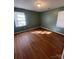 Spacious bedroom with hardwood floors and plenty of natural light at 1024 Eaglewood Ave, Charlotte, NC 28212