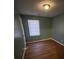 Bright bedroom with hardwood floors and a single window at 1024 Eaglewood Ave, Charlotte, NC 28212