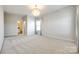 Bright bedroom with ensuite bathroom and chandelier at 1056 Emory Ln, Fort Mill, SC 29708