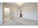 Simple bedroom with carpet flooring and walk-in closet at 1056 Emory Ln, Fort Mill, SC 29708