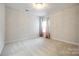 Bright bedroom with neutral carpeting and a chandelier at 1056 Emory Ln, Fort Mill, SC 29708