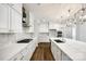 Spacious kitchen featuring white cabinets, quartz countertops, and hardwood floors at 1056 Emory Ln, Fort Mill, SC 29708