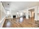 Open living room with hardwood floors and fireplace at 1056 Emory Ln, Fort Mill, SC 29708