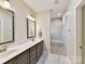 Double vanity bathroom with large walk-in shower at 1115 Millview Ln, Matthews, NC 28104