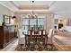 Bright dining room features a chandelier and seating for four at 1115 Millview Ln, Matthews, NC 28104