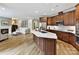 Modern kitchen with island, stainless steel appliances, and wood cabinets at 1115 Millview Ln, Matthews, NC 28104