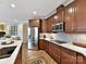 Modern kitchen with stainless steel appliances and wood cabinets at 1115 Millview Ln, Matthews, NC 28104