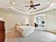 Spacious main bedroom with sitting area and ceiling fan at 1115 Millview Ln, Matthews, NC 28104