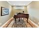 Basement music room with grand piano and area rug at 1115 Millview Ln, Matthews, NC 28104