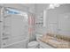 Bathroom with shower/tub combo, granite countertop, and patterned curtain at 116 Van Gogh Trl, Mount Holly, NC 28120