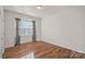 Simple bedroom with hardwood floors and a window at 116 Van Gogh Trl, Mount Holly, NC 28120