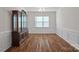 Formal dining room with hardwood floors and wood hutch at 116 Van Gogh Trl, Mount Holly, NC 28120