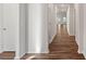 Hardwood floor hallway with doors to other rooms at 116 Van Gogh Trl, Mount Holly, NC 28120