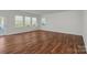 Hardwood floor living room with access to patio at 116 Van Gogh Trl, Mount Holly, NC 28120