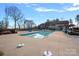 Community swimming pool with lounge chairs and clubhouse at 116 Van Gogh Trl, Mount Holly, NC 28120