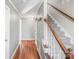 Hallway with hardwood floors and staircase at 13010 Marlstone Ln, Charlotte, NC 28215