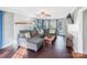 Living room with L-shaped sectional sofa and fireplace at 13010 Marlstone Ln, Charlotte, NC 28215