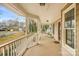 Front porch with rocking chairs and white railings at 13010 Marlstone Ln, Charlotte, NC 28215