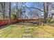 Stone pathway leading through a tranquil backyard at 1334 Woodland Dr, Charlotte, NC 28205