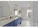 Elegant bathroom with dual vanity, marble countertops, and gold accents at 1334 Woodland Dr, Charlotte, NC 28205