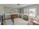 Charming Bedroom with built-in shelving and crib at 1334 Woodland Dr, Charlotte, NC 28205