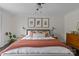 Bright bedroom with king-size bed, stylish decor, and hardwood floors at 1334 Woodland Dr, Charlotte, NC 28205