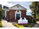 Brick building with a welcoming entryway and sign at 1334 Woodland Dr, Charlotte, NC 28205