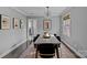 Modern dining room featuring a sleek table and velvet chairs at 1334 Woodland Dr, Charlotte, NC 28205