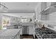 Updated kitchen featuring stainless steel farm sink and gas range at 1334 Woodland Dr, Charlotte, NC 28205