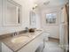 Bathroom with double vanity and granite countertop at 1346 5Th Street Nw Cir, Hickory, NC 28601