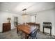 Dining room with a large wooden table and a crystal chandelier at 1346 5Th Street Nw Cir, Hickory, NC 28601