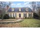 Charming yellow house with a brick pathway, and well-manicured lawn at 1346 5Th Street Nw Cir, Hickory, NC 28601