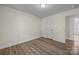 Simple bedroom with wood-look floors and neutral wall color at 1417 Wildwood Dr, Kannapolis, NC 28081