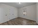 Simple bedroom with double door closet and window at 1417 Wildwood Dr, Kannapolis, NC 28081