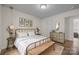 Bedroom with metal bed frame and neutral decor at 1417 Wildwood Dr, Kannapolis, NC 28081