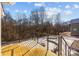 Wooden deck overlooking a snowy yard and wooded area at 1417 Wildwood Dr, Kannapolis, NC 28081