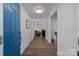 Bright entryway with hardwood floors and blue door at 1417 Wildwood Dr, Kannapolis, NC 28081