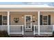 Inviting front porch with white railings and door at 1417 Wildwood Dr, Kannapolis, NC 28081