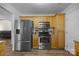 Stainless steel appliances and light wood cabinets in kitchen at 1417 Wildwood Dr, Kannapolis, NC 28081