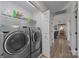 Laundry room with washer, dryer, and shelving at 1417 Wildwood Dr, Kannapolis, NC 28081