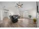 Spacious living room with vaulted ceiling, fireplace, and hardwood floors at 1417 Wildwood Dr, Kannapolis, NC 28081