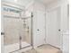 Modern bathroom with a shower and tiled walls at 146 Dogwood Grove Pl, Troutman, NC 28166