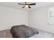 Neutral bedroom with carpet, ceiling fan and a window for natural light at 146 Dogwood Grove Pl, Troutman, NC 28166